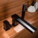 Deck-Mount Waterfall Bathtub Tap in Solid Black with Handshower